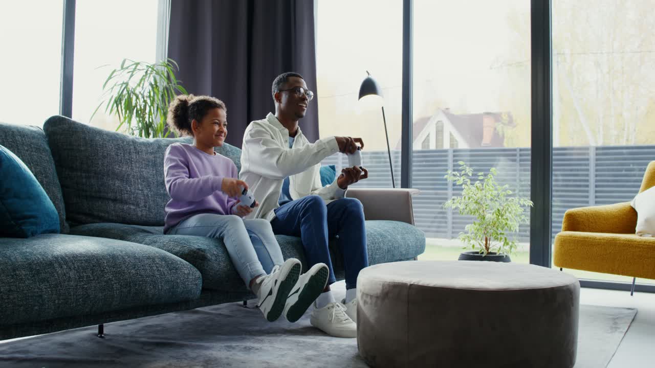 Father and Daughter Playing Video Games Together