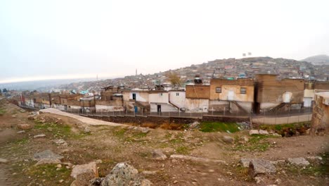 view on old city from urfa castle snow and rain
