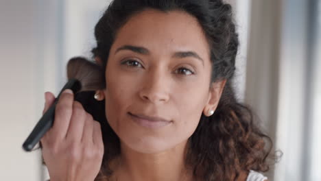 portrait beautiful woman applying makeup getting ready at home looking in mirror enjoying natural complexion