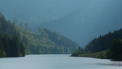 the level of the sance drinking water reservoir with a natural valley full of hills and mountains around the water level which moves in a strong wind