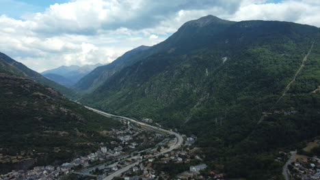 aerial view of a mountain valley with highway and town