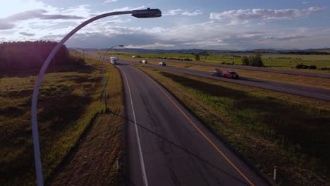 Semi-truck-by-highway-approached-sun-flare