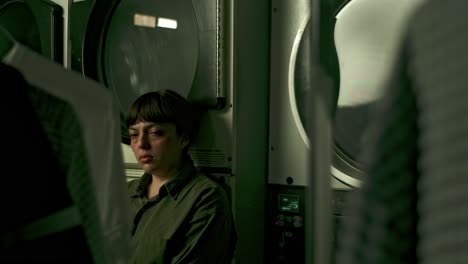 lonely latina woman in laundry chore, desolate environment, melancholic day, depression