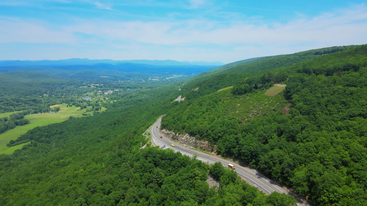 Aerial drone video footage of a scenic mountain highway byway in the Appalachian Mountains. This is in the Shawangunk Mountain sub-range in new york’s Hudson valley during summer time.