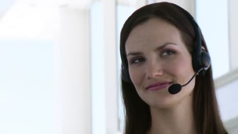 Smiling-Business-woman-with-headset-on