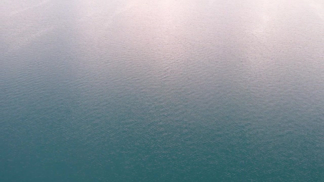 Aerial View of Calm Teal Ocean Water Surface