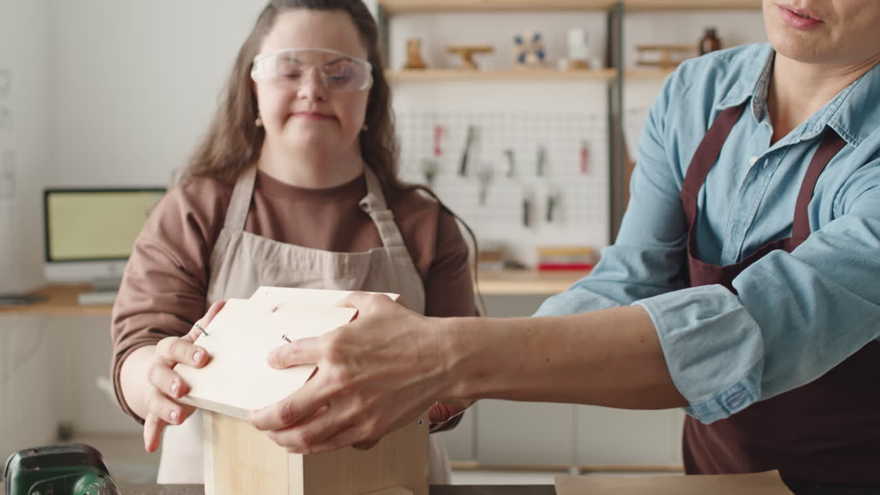 People crafting birdhouse