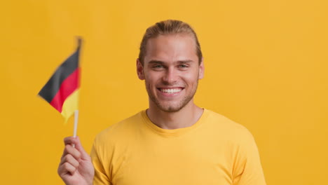 man holding german flag