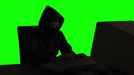 young hacker stealing secret data from computer