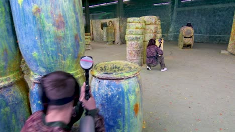 girls and boys playing indoor paintball-8