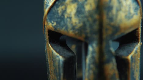 a close up macro cinematic shot of a spartan face design, warrior metal bronze helmet, on a 360 rotating stand, studio lighting, 4k slow movement