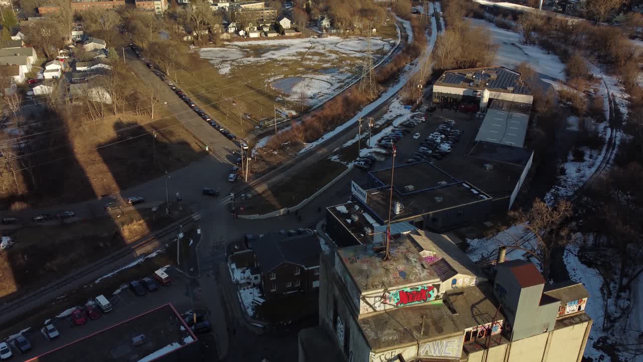 Drone ascending over abandoned grain mill moving towards Minneapolis, MN
