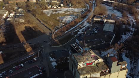 drone ascending over abandoned grain mill moving towards minneapolis, mn