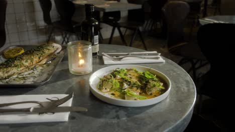 Plate-with-fish-is-served-in-a-restaurant