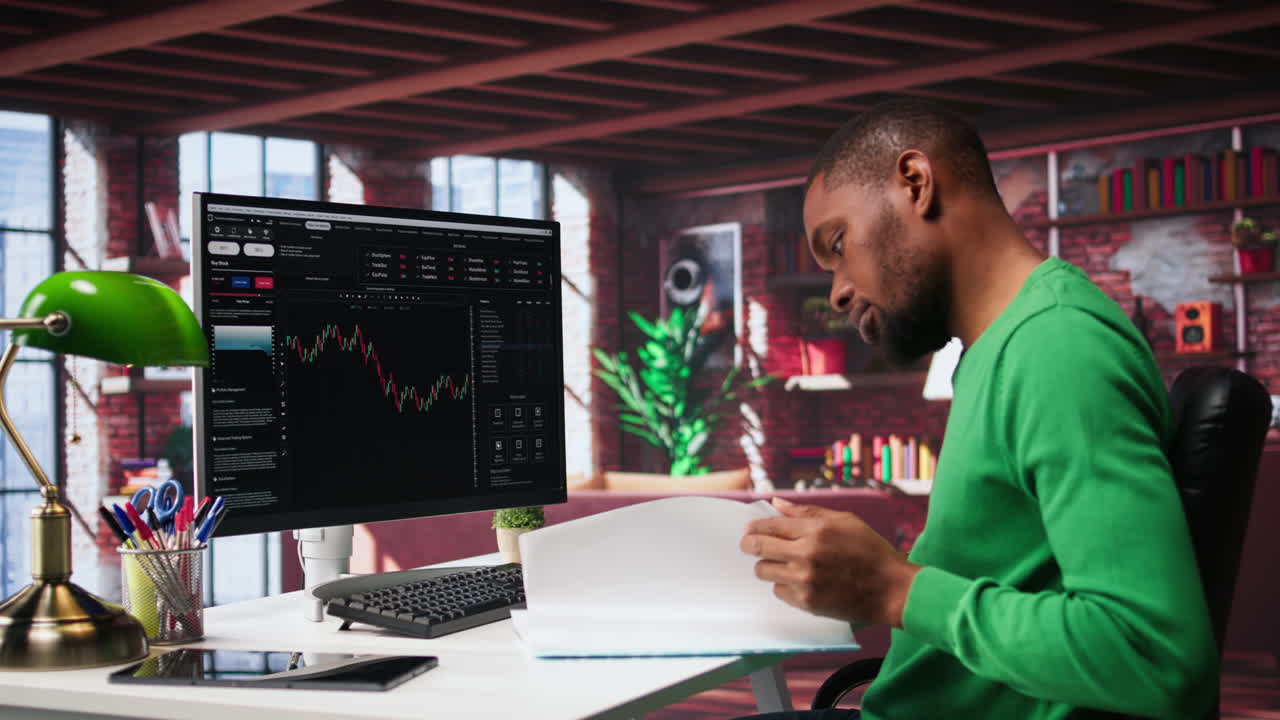 Vertical Video African american man using PC to purchase and sell stocks