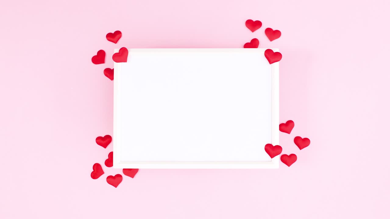 Hearts move around Valentine's day frame for text. Stop motion
