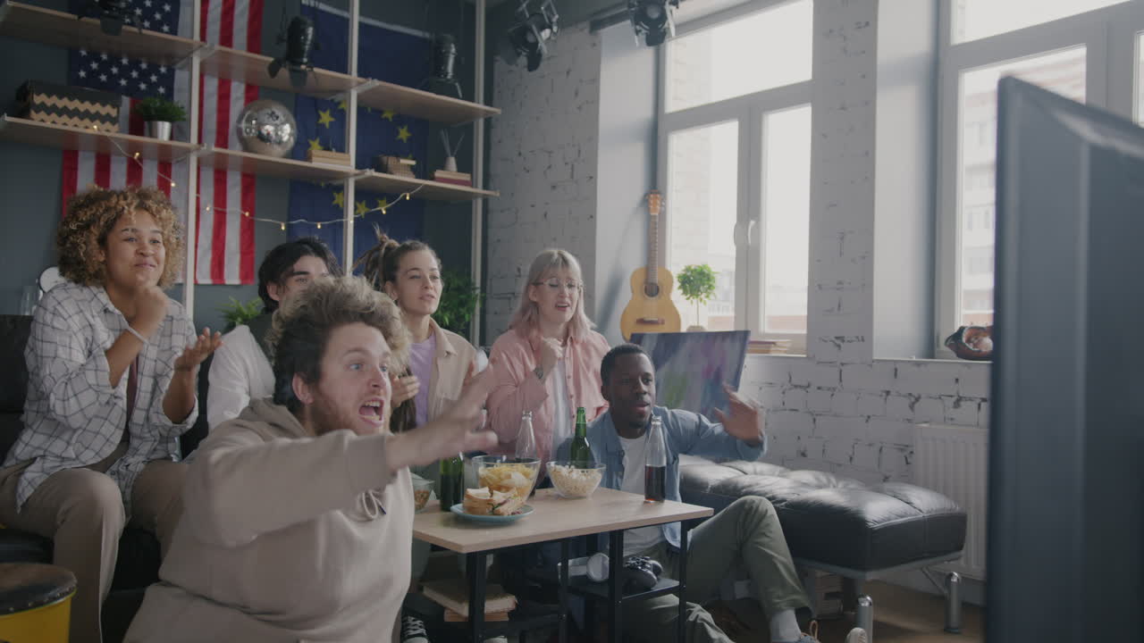 Friends Watching TV and Celebrating