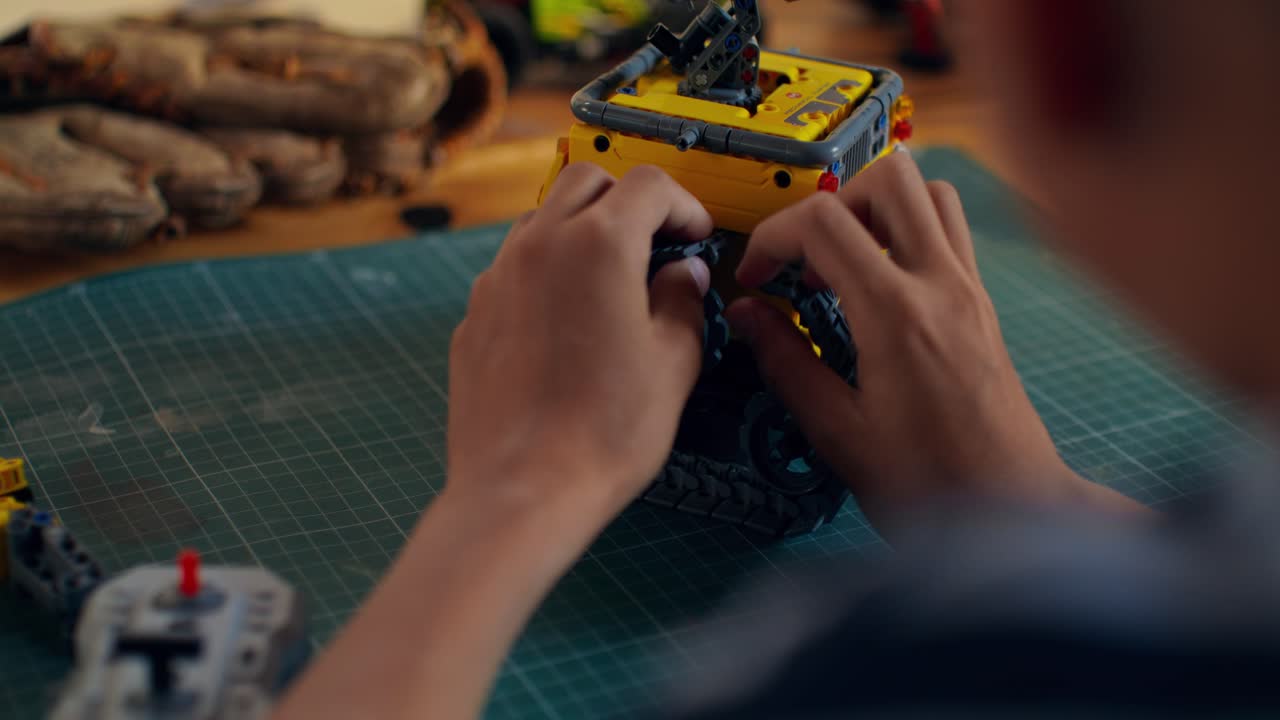 Child Building a Lego Robot Toy