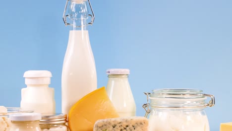 assorted dairy items displayed against blue backdrop