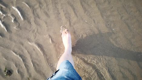 walking barefoot across the beach