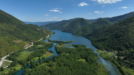 aerial view of a large artificial lake located next to an intercity road