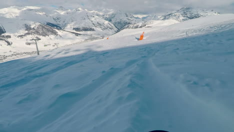 go pro on snowboard with fast movement in livigno, italian alps