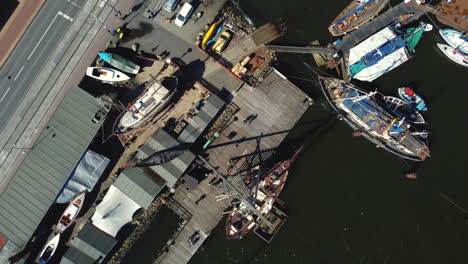 aerial view of a busy harbor with boats under repair