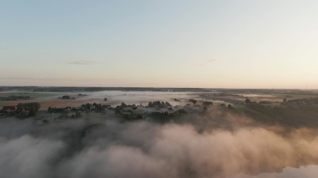 Flying over river Nemunas  with fog in the early morning near Raudondvaris, Lithuania. Aerial view
