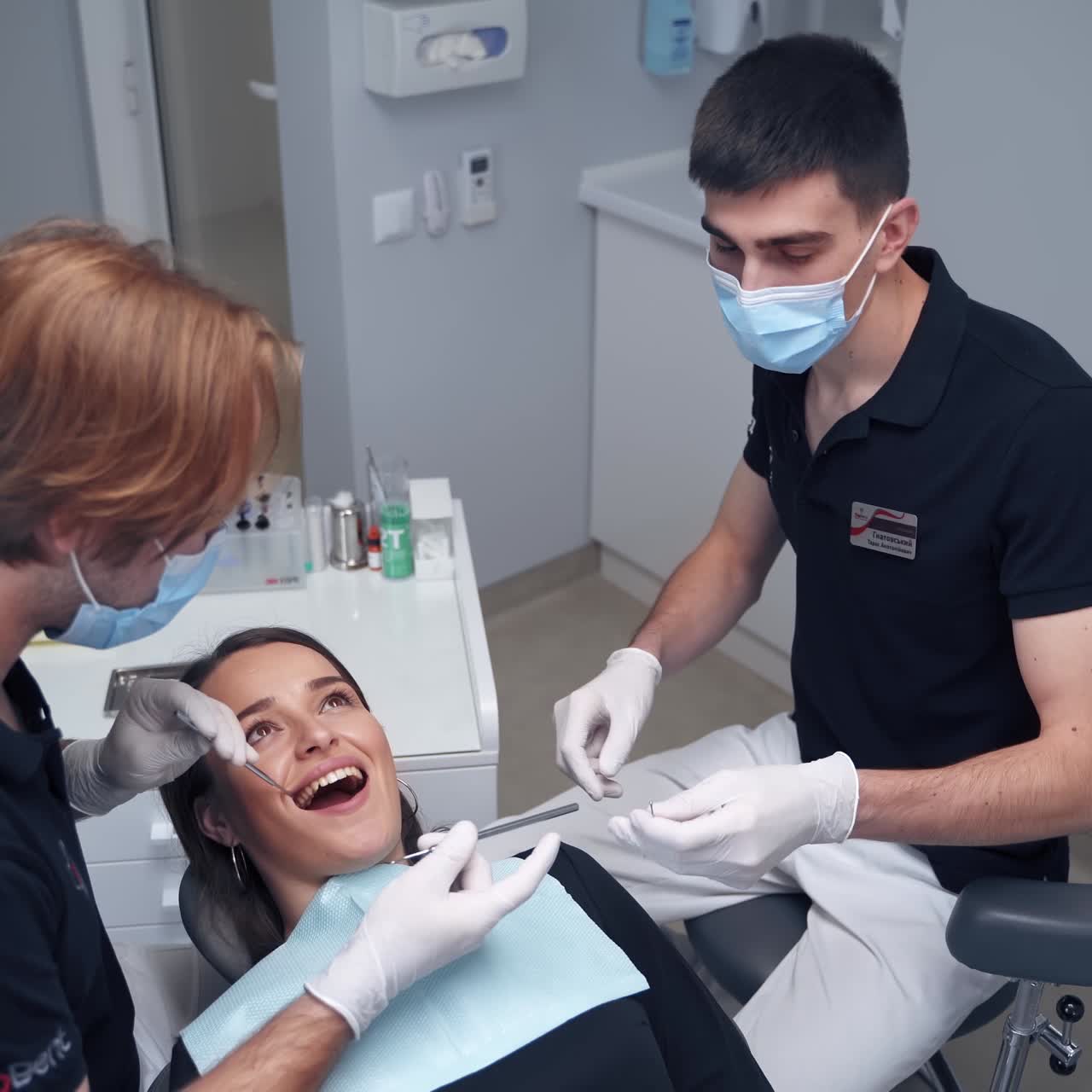 Dentist examining woman