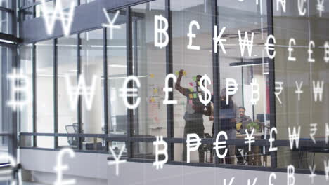 animation of currency symbols over diverse business people discussing work in office