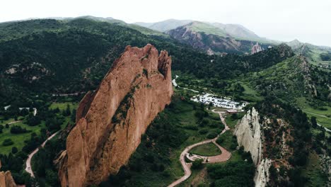 drone shot pushing towards garden of the gods' unique rock formation