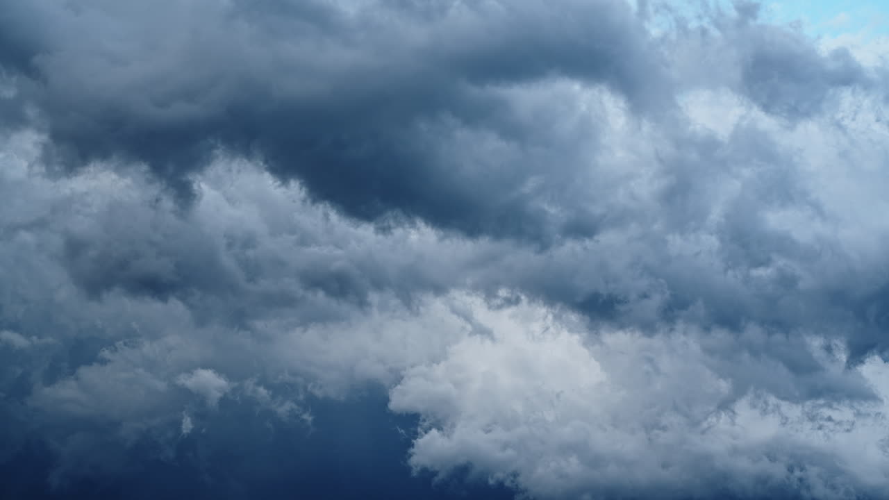 Dramatic clouds swirling in sky, capturing a moody, dynamic timelapse