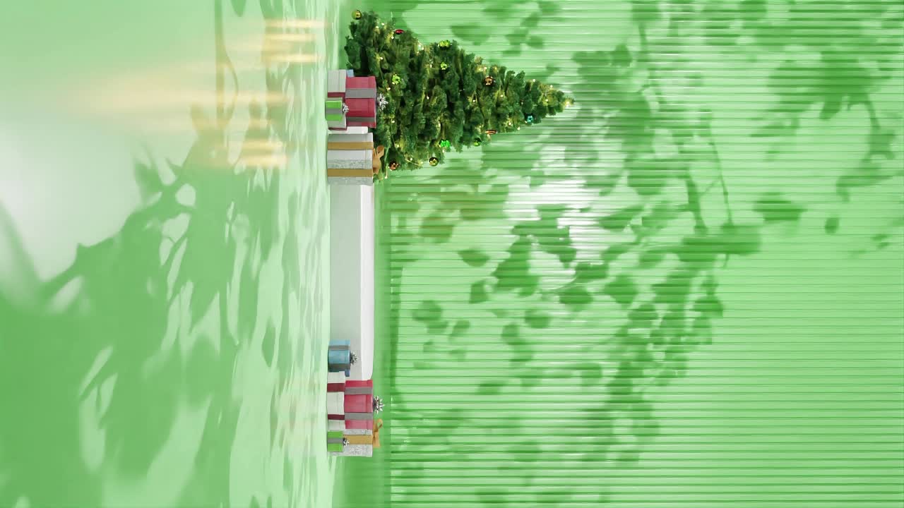 árbol de navidad con adornos y regalos envueltos en un piso verde contra un fondo verde