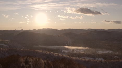 a fantastic view of the snowy valley and the sun
