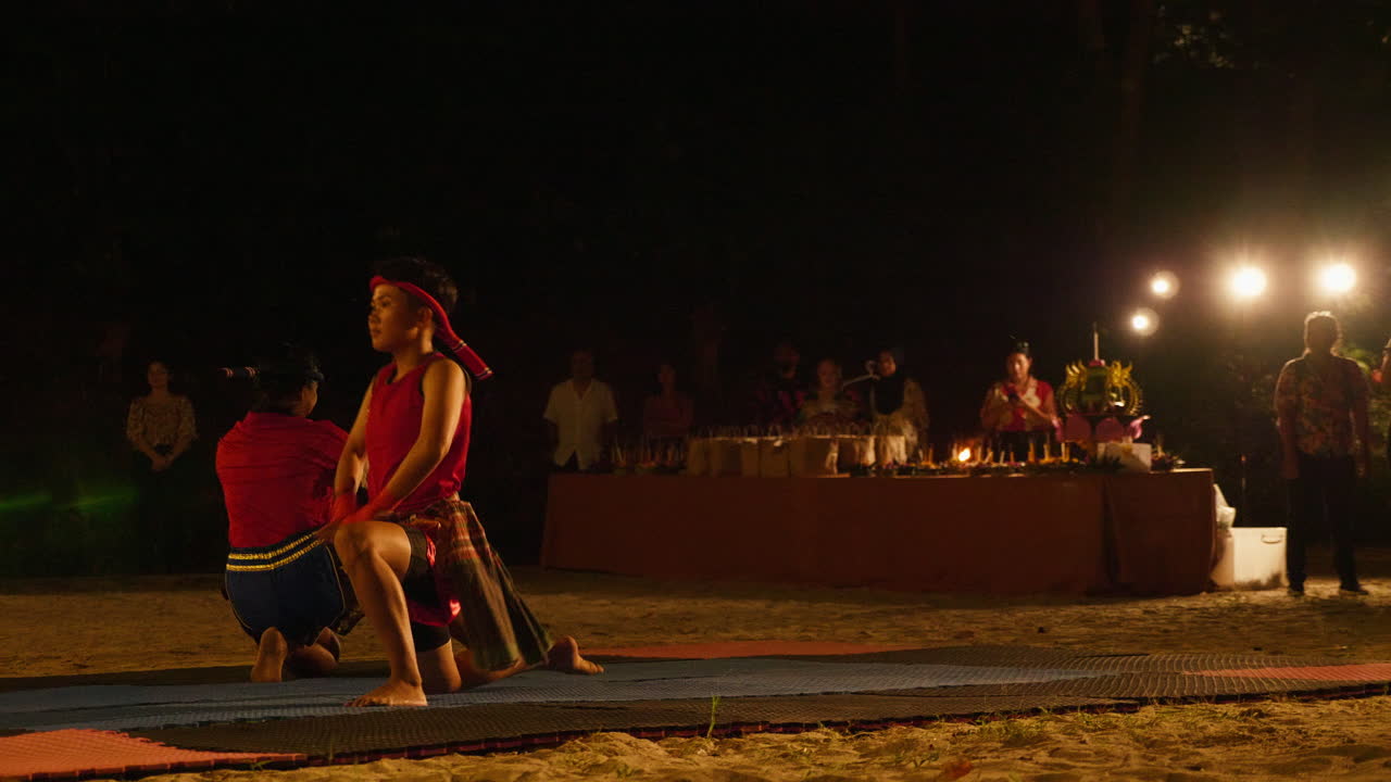 Muay Thai Performance on Beach at Night