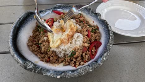 two people enjoying and sharing a hearty meal.