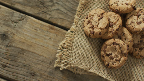 video of biscuits with chocolate on wooden background