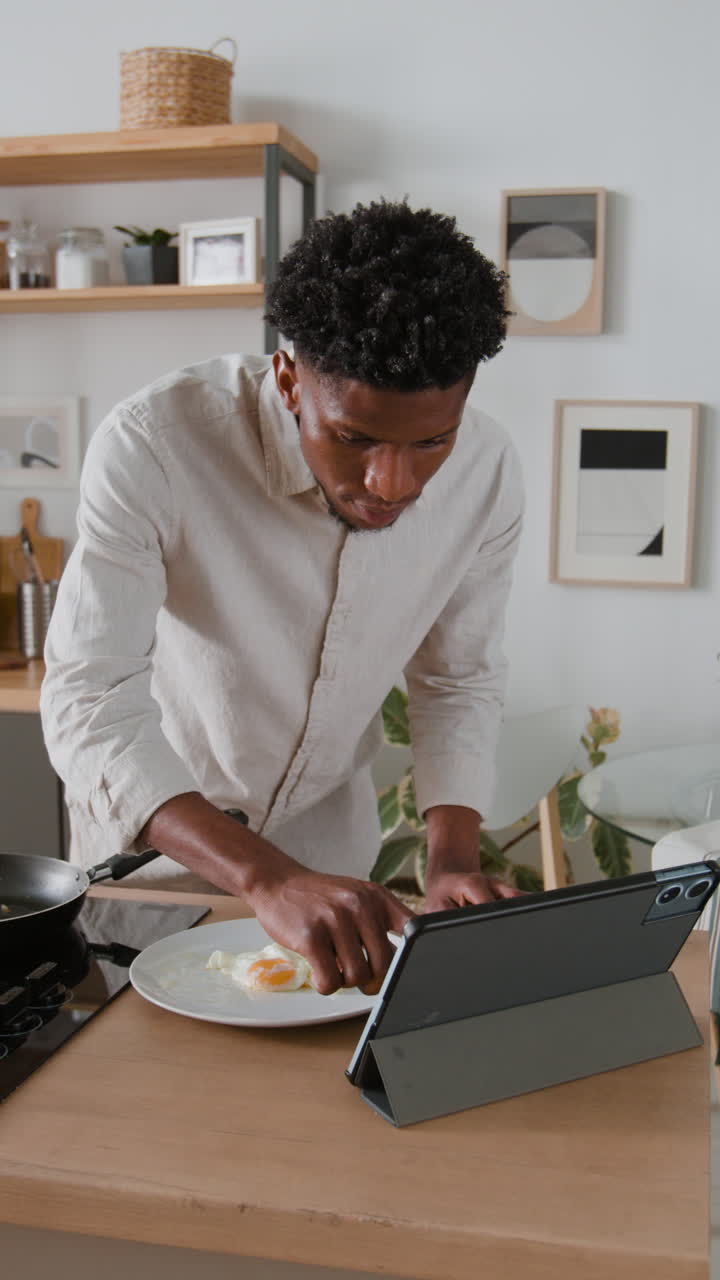 Man Cooking Breakfast in Kitchen