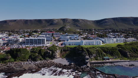 aerial arc on hermanus coastline reveals scenic seaside holiday destination