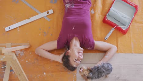 portrait of a caucasian woman in quarantine during coronavirus pandemic, doing interior work