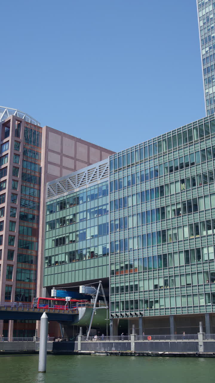 A Railway moving through Canary Wharf. Vertical, London, England