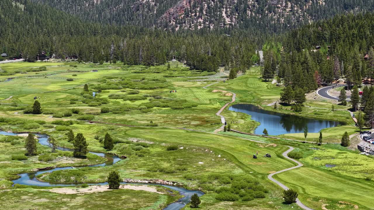 Landscape of Olympic Valley in Summer Season, California USA. Drone Shot of Green Fields, Creek and Pond