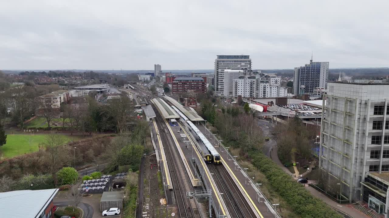 Two trains leaving Basingstoke station drone tracking