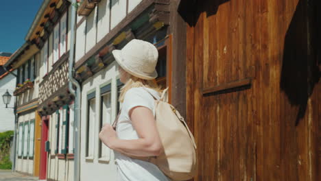 happy tourist admires old street in germany