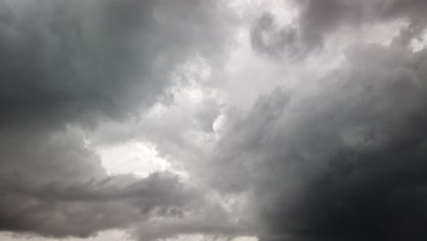 Ominous-dark-grey-storm-clouds,-fast-gloomy-cloudscape-time-lapse