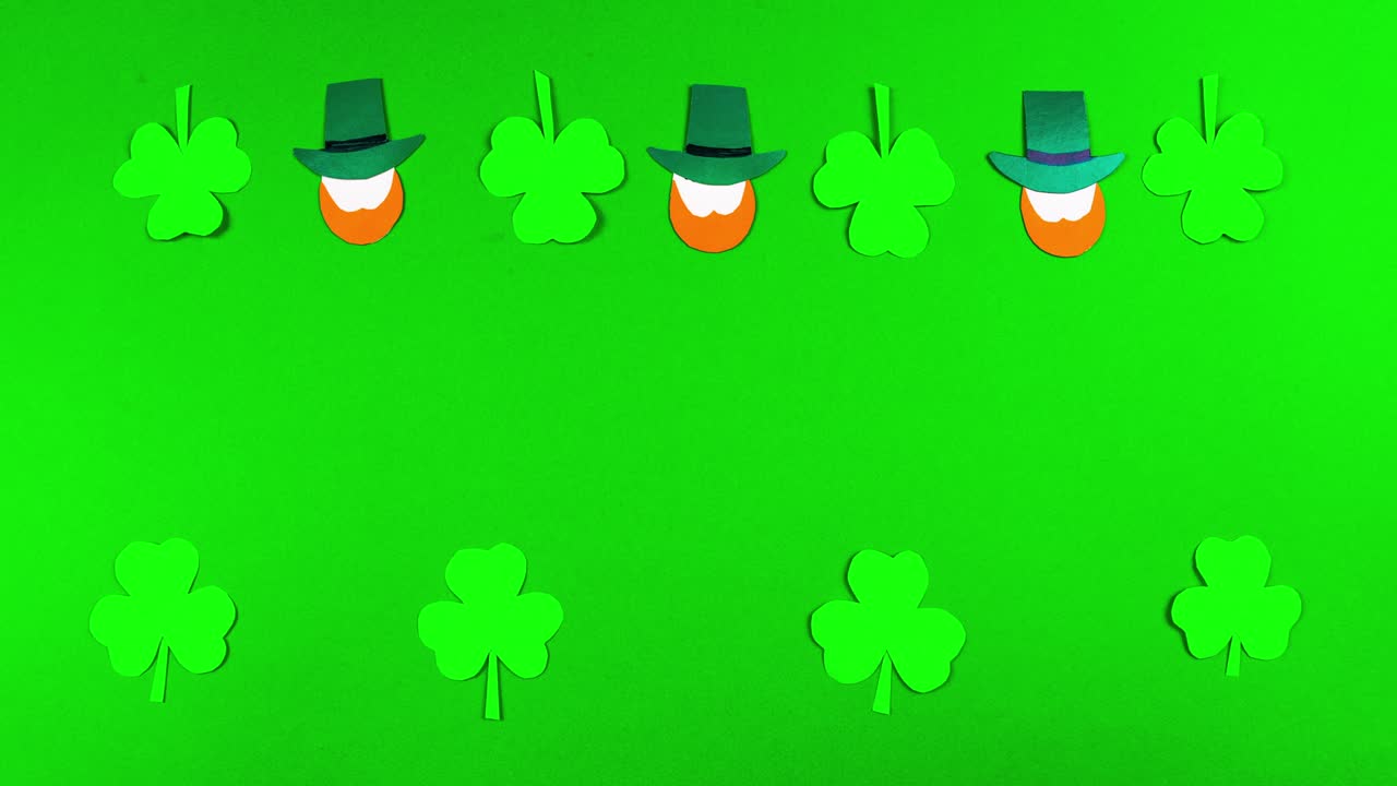 tarjeta de felicitación 4k para el día de san patricio, que se celebra el 17 de marzo. fiesta cultural irlandesa. símbolos de la fiesta un trébol y leprechauns. fondo verde.