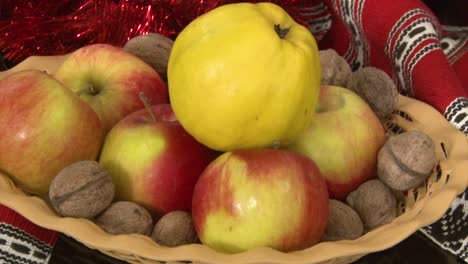 apples, quinces, walnuts in a basket