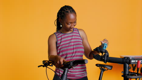 Atelier-shop-employee-setting-up-bike-repair-stand-to-fix-busted-wheels