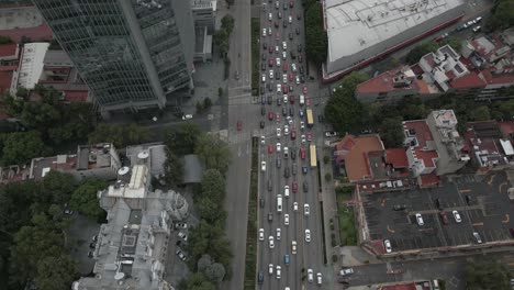 city aerial tracks vehicle traffic on multi lane street in modern city