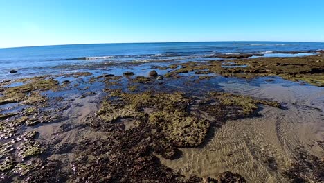 Pan-across-the-tide-going-out,-Rocky-Point,-Puerto-Peñasco,-Gulf-of-California,-Mexico